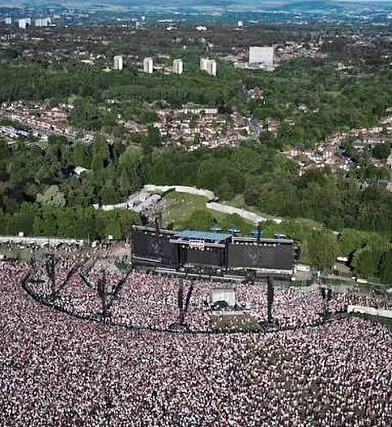 Aerial view of a huge crowd in front of the stage at Heaton Park, Manchester
