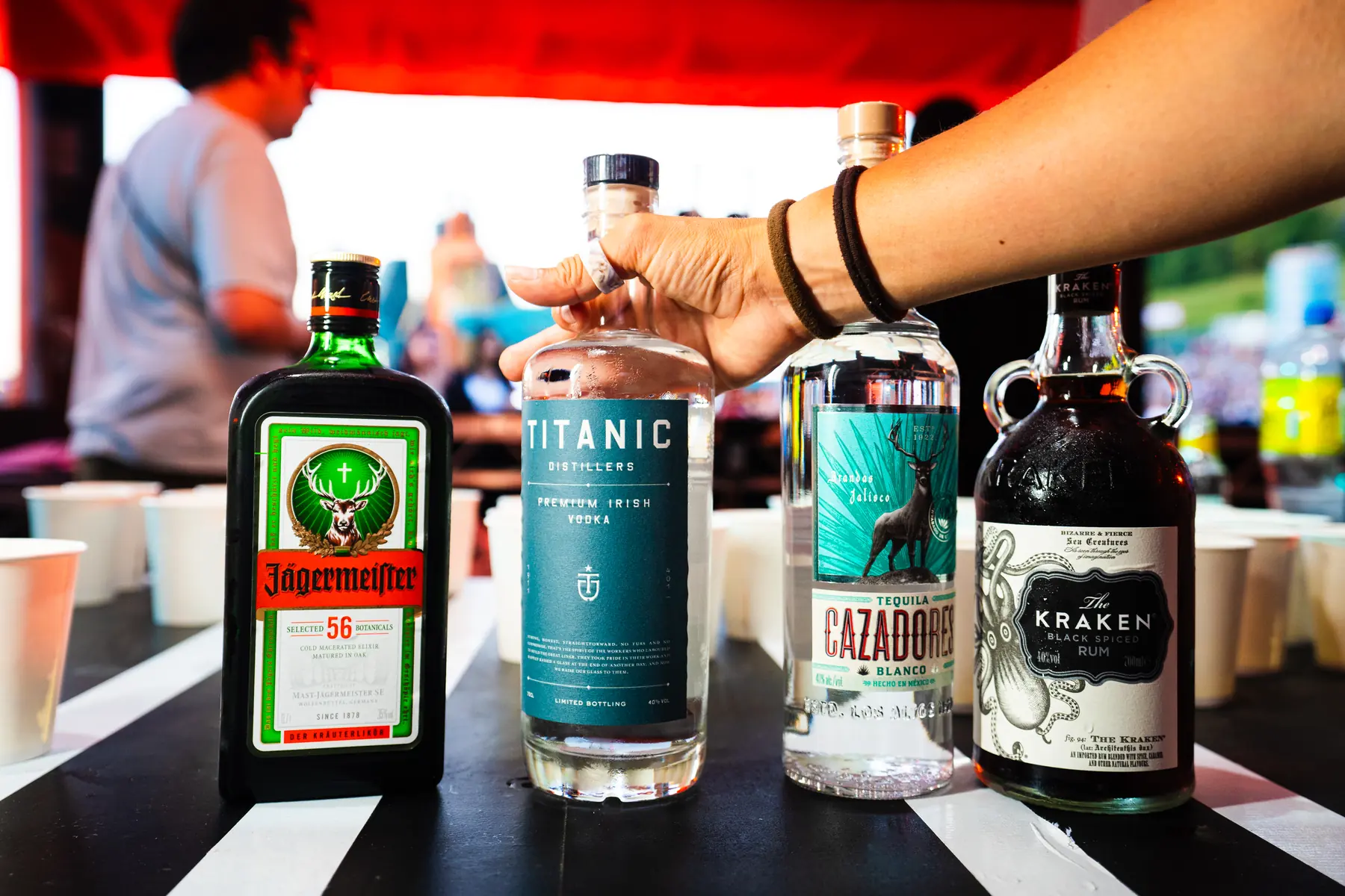 Spirits bottles lined up on a bar