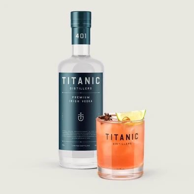 Titanic vodka with a red cocktail in a branded tumbler